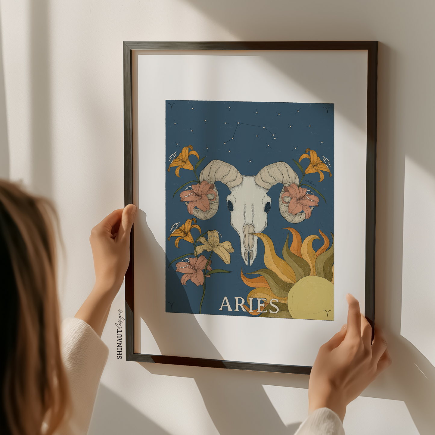 aries zodiac art print with woman holding frame