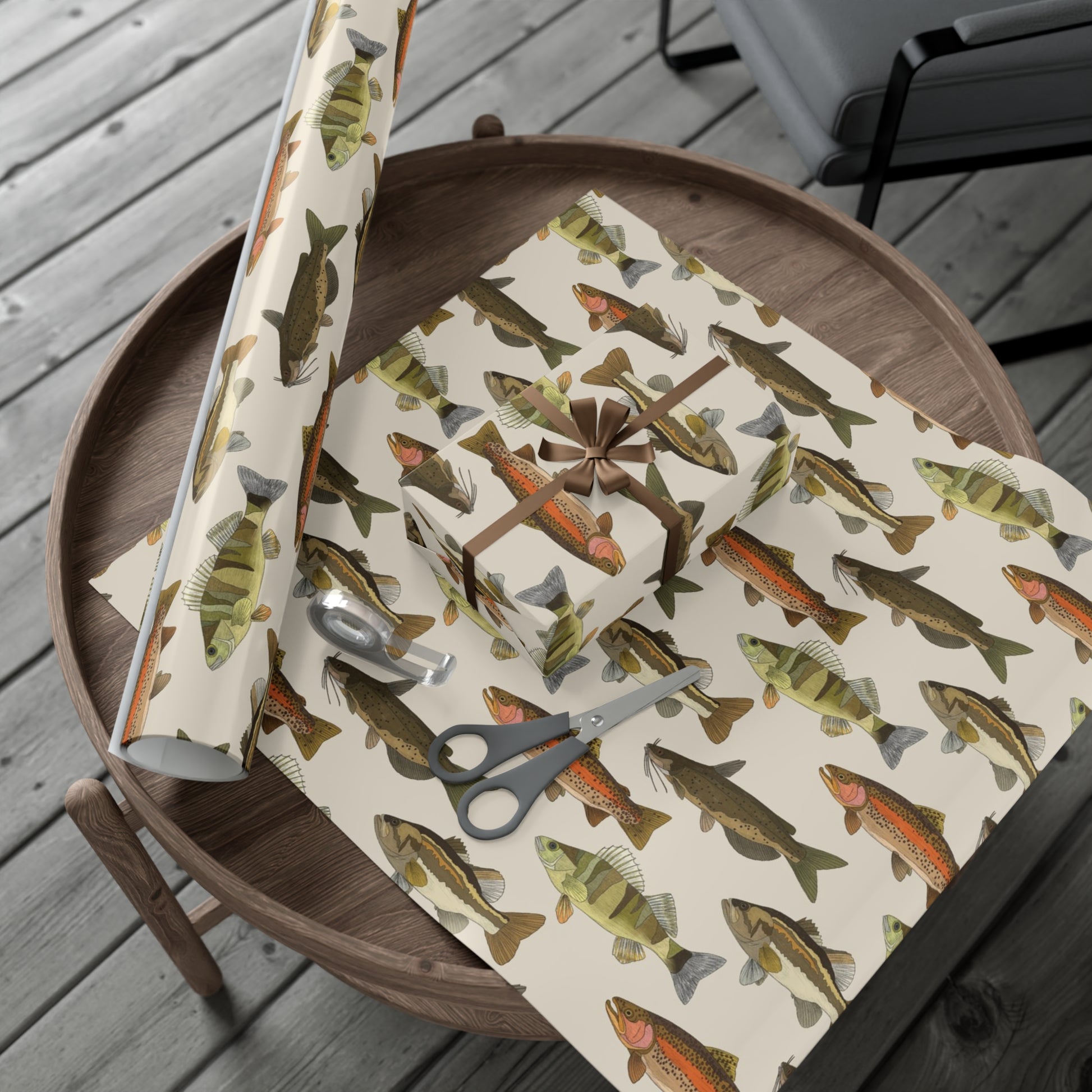 30x72 freshwater fish wrapping paper on table with tape and scissors