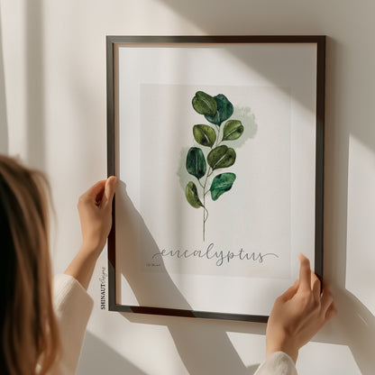 eucalyptus art print holding black picture frame