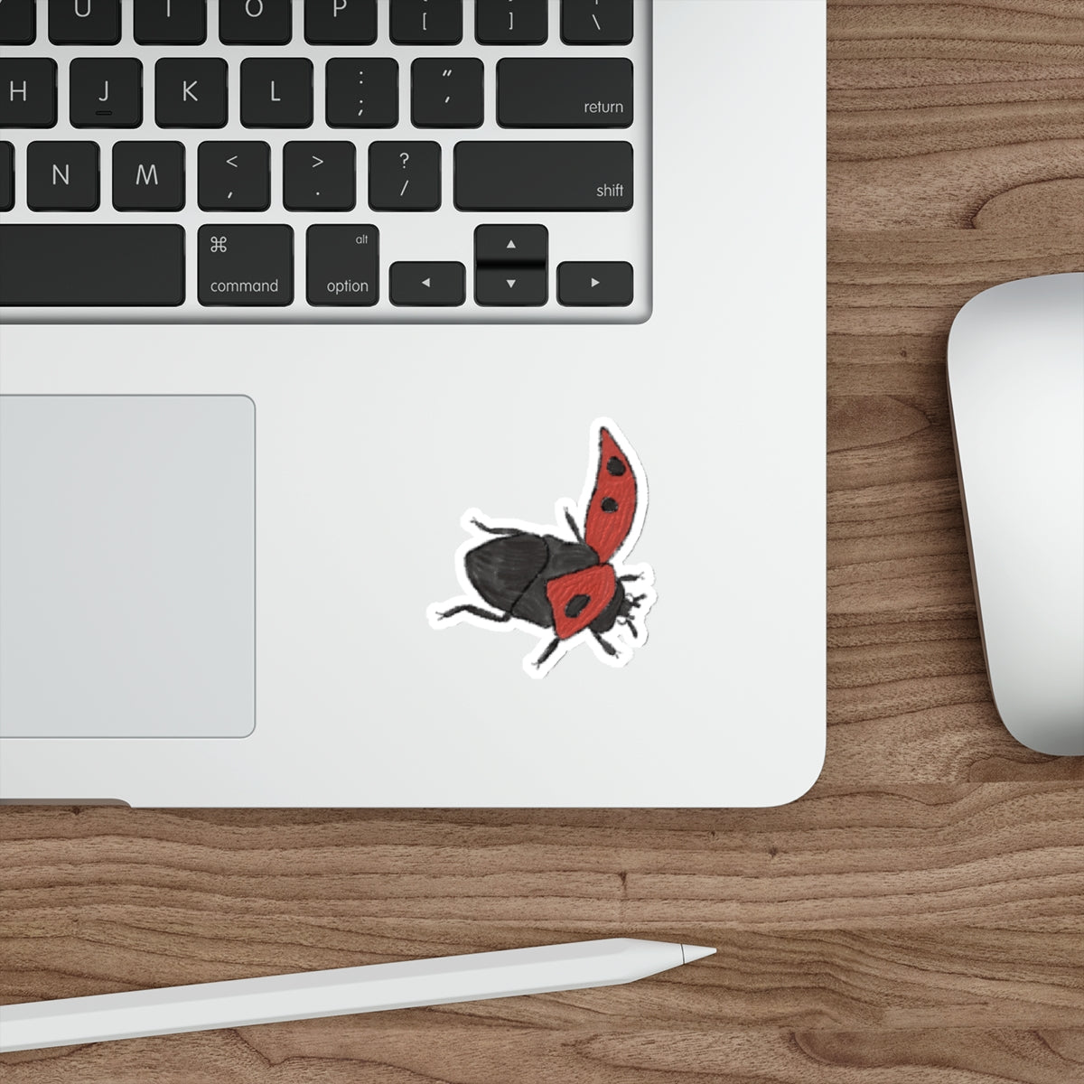 flying ladybug die-cut sticker on laptop