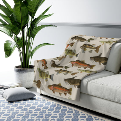 freshwater fish sherpa blanket living room scene draped on a couch with tree and pillow