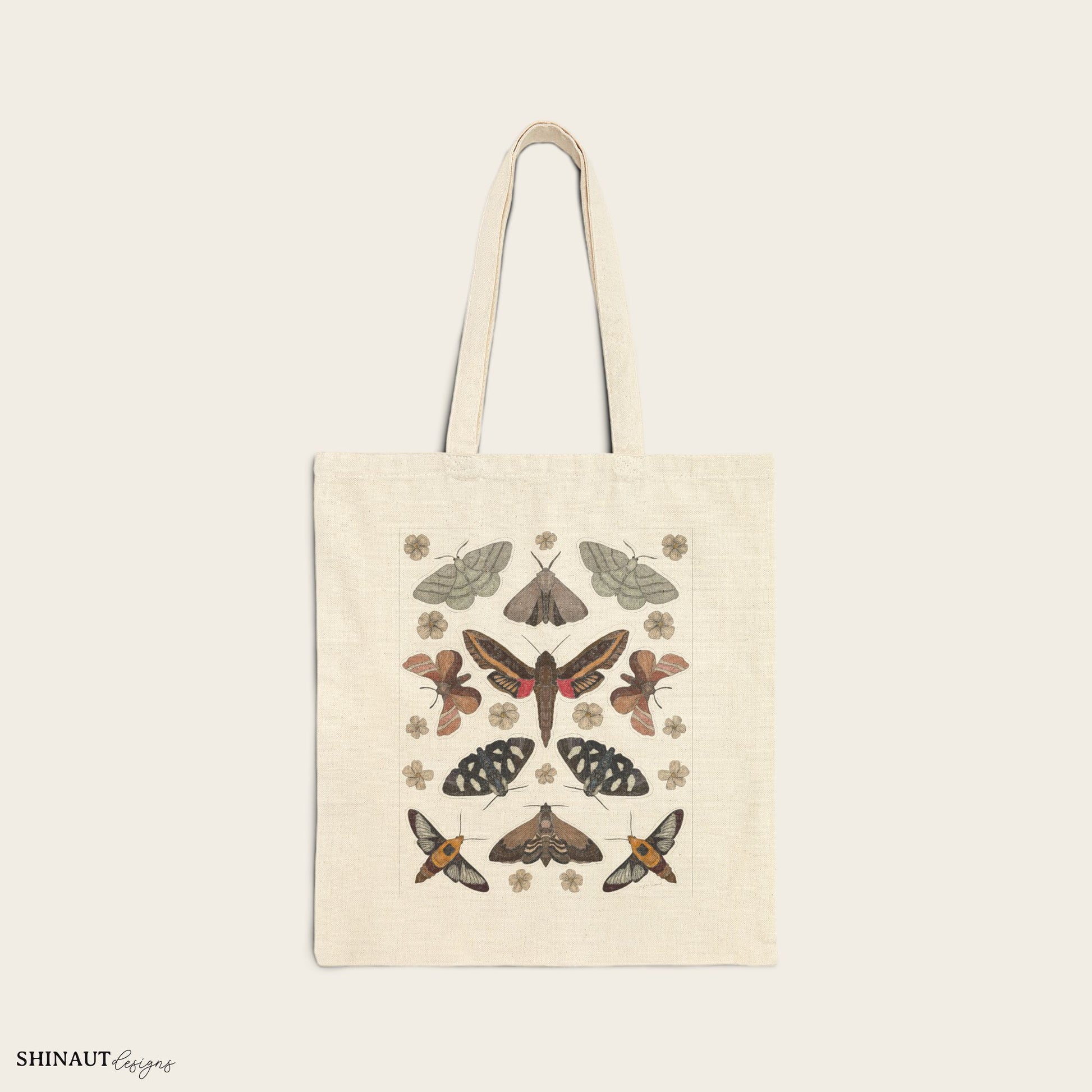 garden moths with white flowers tote bag