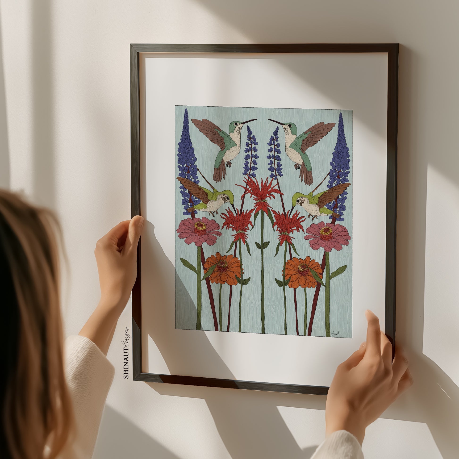 hummingbird nouveau art print with hands holding frame