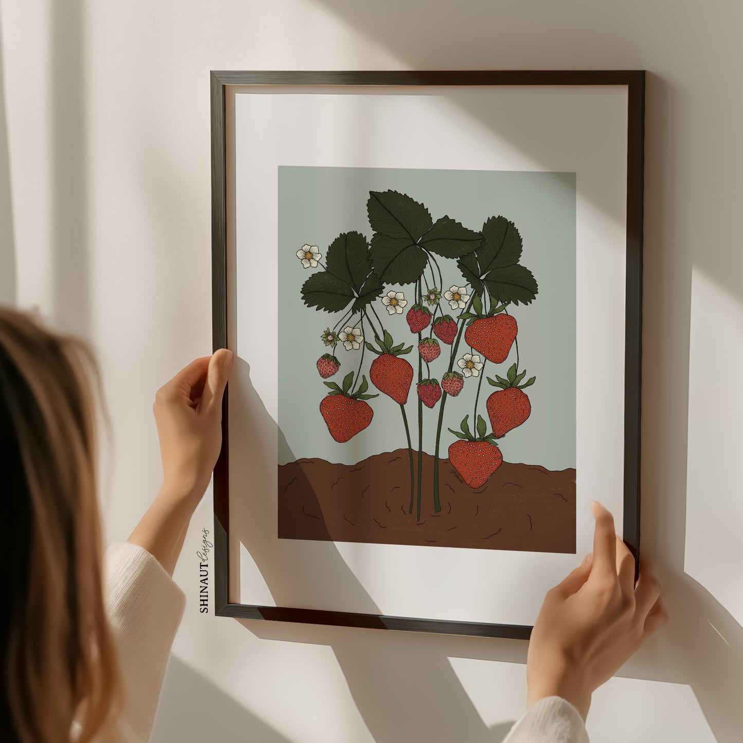 strawberry plant art print with woman hands