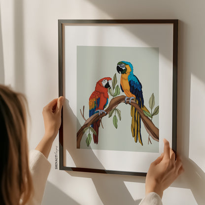 the macaws art print with hands holding frame